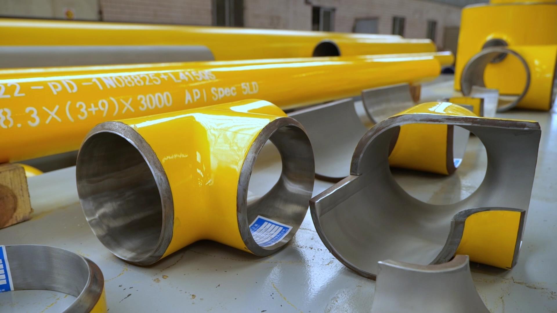 jlc jinglei clad pipes, clad pipe, welded clad pipe, welding clad pipe, Alloy Cladded Pipe， Explosion Welded Clad Pipes, welded clad fitting, fittings